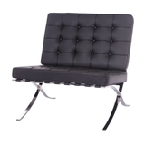 Black leather chair with chrome legs on a white background