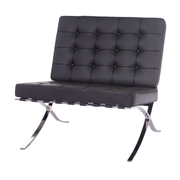 Black leather chair with chrome legs on a white background